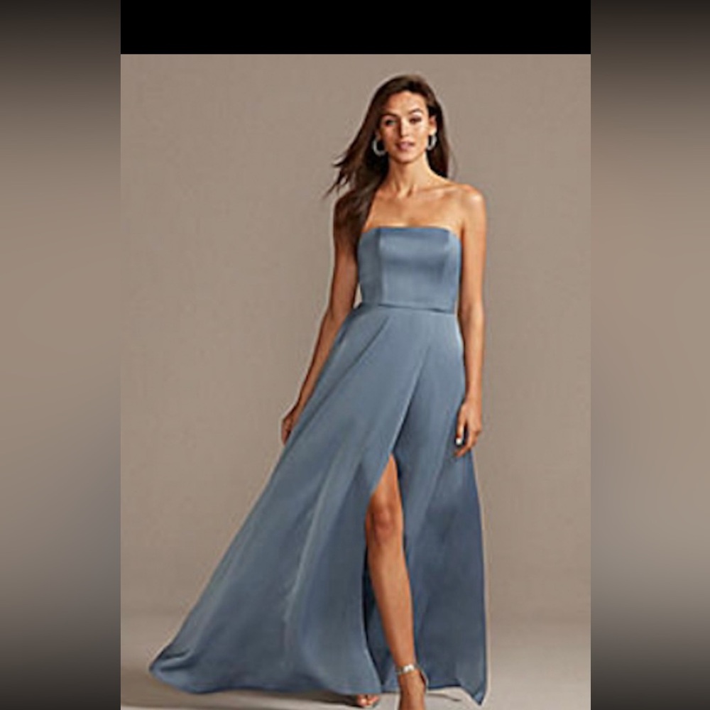 Never worn. Still new in bag with the tags. It is a size  14. The color is Spa.